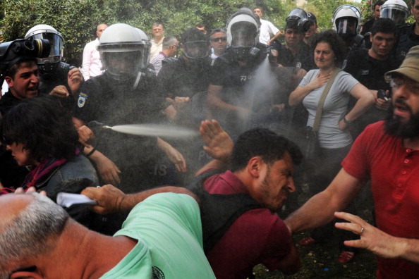 Police reportedly used tear gas on May 28 to disperse a group protesting the demolition of Taksim Gezi Park in Istanbul. This was just one of many recent instances where Turkish police have used excessive force to repress peaceful protests (Photo Credit: Bulent Kilic/AFP/Getty Images).