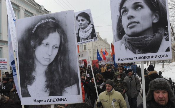 Opposition activists attend an anti-government rally in Moscow to demand the release of political prisoners, among them the still-jailed members of the female punk band Pussy Riot (Photo Credit: Andrey Smirnov/AFP/Getty Images).