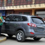 Investigations personnel inspect the car of Honduran Judge Mireya Efigenia Mendoza Pena, where she was found shot dead on July 24, 2013. 64 law professionals including Mendoza have been killed in Honduras since January 2010. (Photo Credit: STR/AFP/Getty Images).