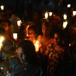 Activists hold lighted candles during a vigil on International Day of the Disappeared in Sri Lanka, where some 12,000 complaints of enforced disappearances have been submitted to the U.N. since the 1980s (Photo Credit: Lakruwan Wanniarachchi/AFP/Getty Images).