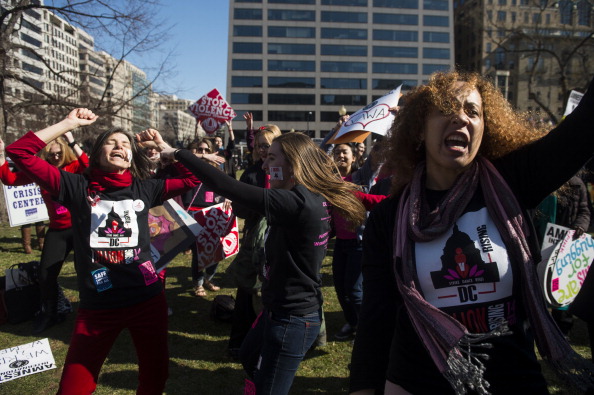Supporters of the Violence Against Women Act dance in Farragut Square as part of the V-DAY’s One Billion Rising dance party and rally to stop violence against women (Photo Credit: Bill Clark/CQ Roll Call).