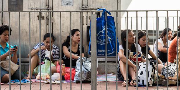 There are more than 300,000 migrant domestic workers in Hong Kong, with about half from Indonesia (Photo Credit: Amnesty International).