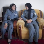 Lieutenant Islam Bibi Helmand's top female police officer (R) talking to a colleague on March 8, 2013. Known as the most senior female police officer in Afghanistan's Helmand province, Bibi was shot dead on July 4, 2013 by unknown gunmen while being driven to work. The attack is seen as part of a series violence against top women officials (Photo Credit: Majid Saeedi/Getty Images).