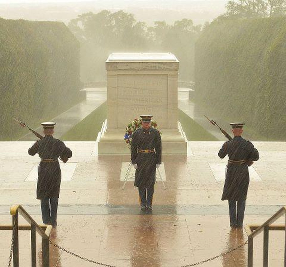 During Hurricane Sandy, NPR posted this image showing soldiers at Arlington National Cemetery guarding the tomb of the unknown soldiers. Though the outlet reported it was taken during the storm, it was actually taken several months before (Photo Credit: NPR).