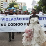 A woman wears a blood-stained wedding dress as she takes part in a protest against a law that allows convicted rapists to be freed from prosecution if they marry the victim (Photo Credit: Jinty Jackson/AFP/Getty Images).