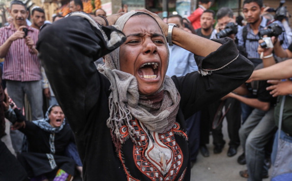 Egyptian defendants' relatives mourn after Egypt court refers 638 Morsi supporters are sentenced to death sentence in the coutnry’s latest mass trial (Photo Credit: Ahmed Ismail/Anadolu Agency/Getty Images).