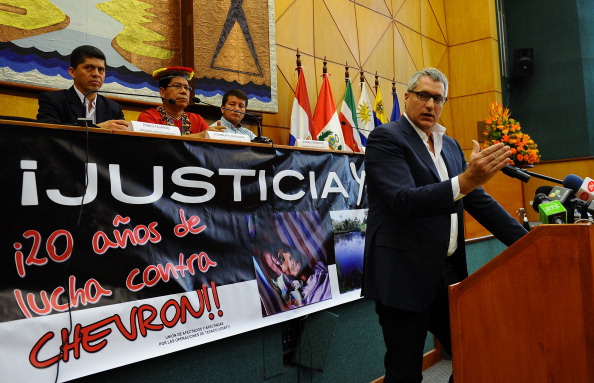 The lawyer of Ecuadorean people affected by Texaco-Chevron --who have long sought compensation for pollution between the 1970s and early 1990s-- Steven Donziger, gestures during a press conference on March 19, 2014 in Quito. (Photo credit: RODRIGO BUENDIA/AFP/Getty Images)