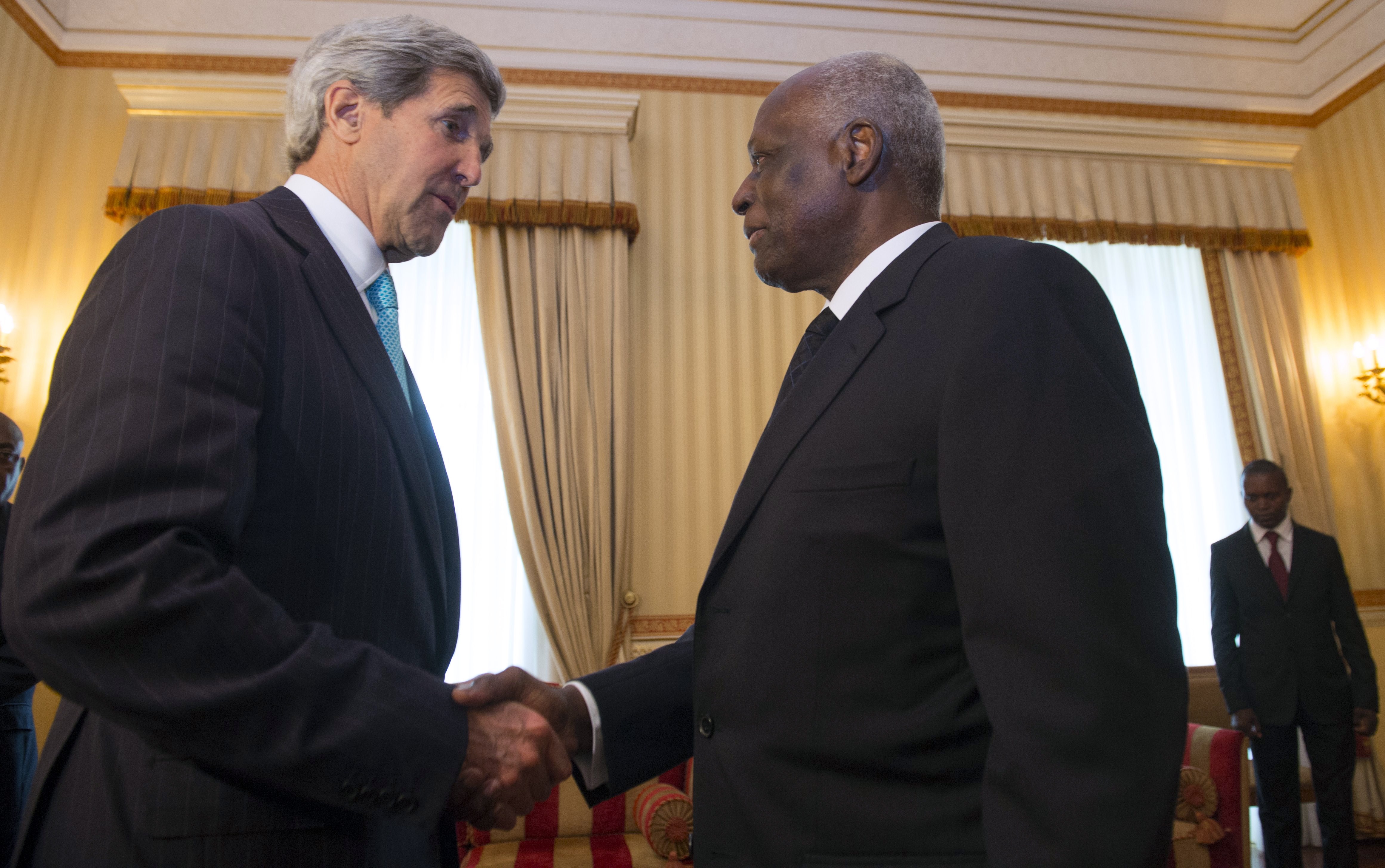 Angolan President Jose Eduardo dos Santos shakes hands with US Secretary of State John Kerry on May 5, 2014. SAUL LOEB/AFP/Getty Images