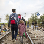 Refugees and migrants cross the border from Greece into Macedonia, 24 August 2015.